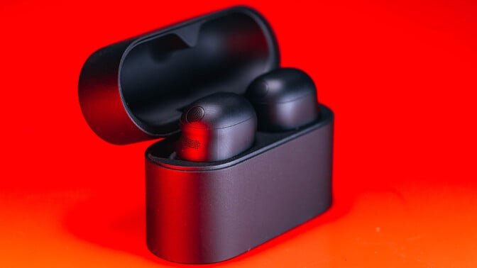 sony wf-1000xm6 earbuds in case on red background
